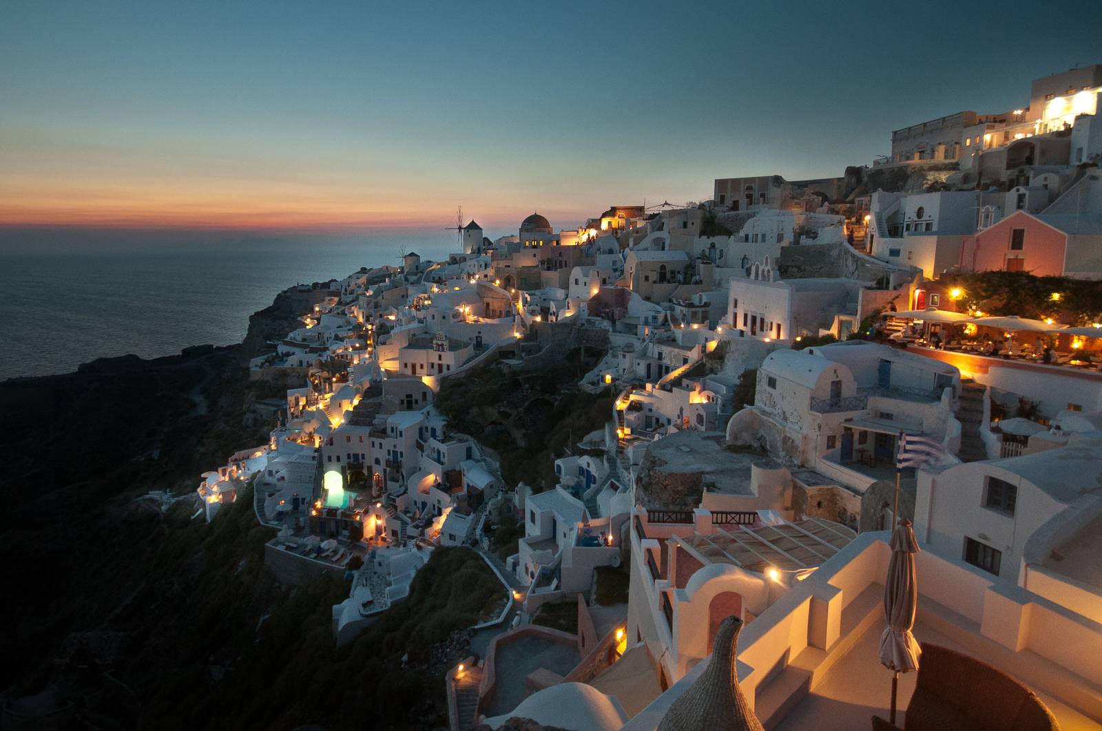Whitewashed village above the Aegean at dusk