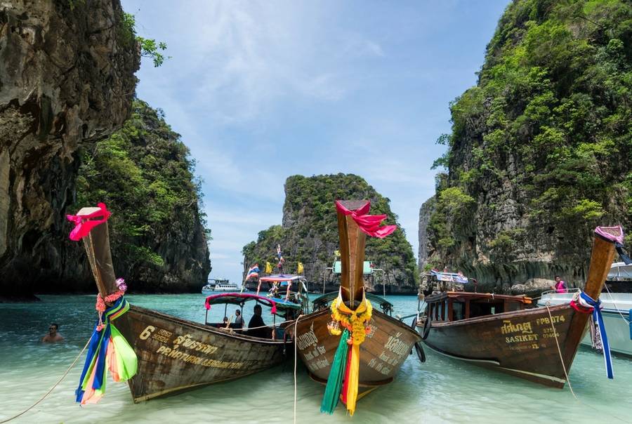Longtail boats in a turquoise lagoon